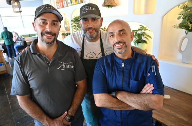 Brothers Roy Nassar, left, Rabih “Robby” Nassar in center, and Badih Nassar, right, have opened Zaatar Bistro in north Fresno’s Via Montana Shopping Center at Shepherd Avenue and Champlain Drive.